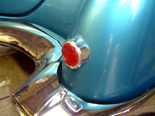 Loose right rear reflector.
